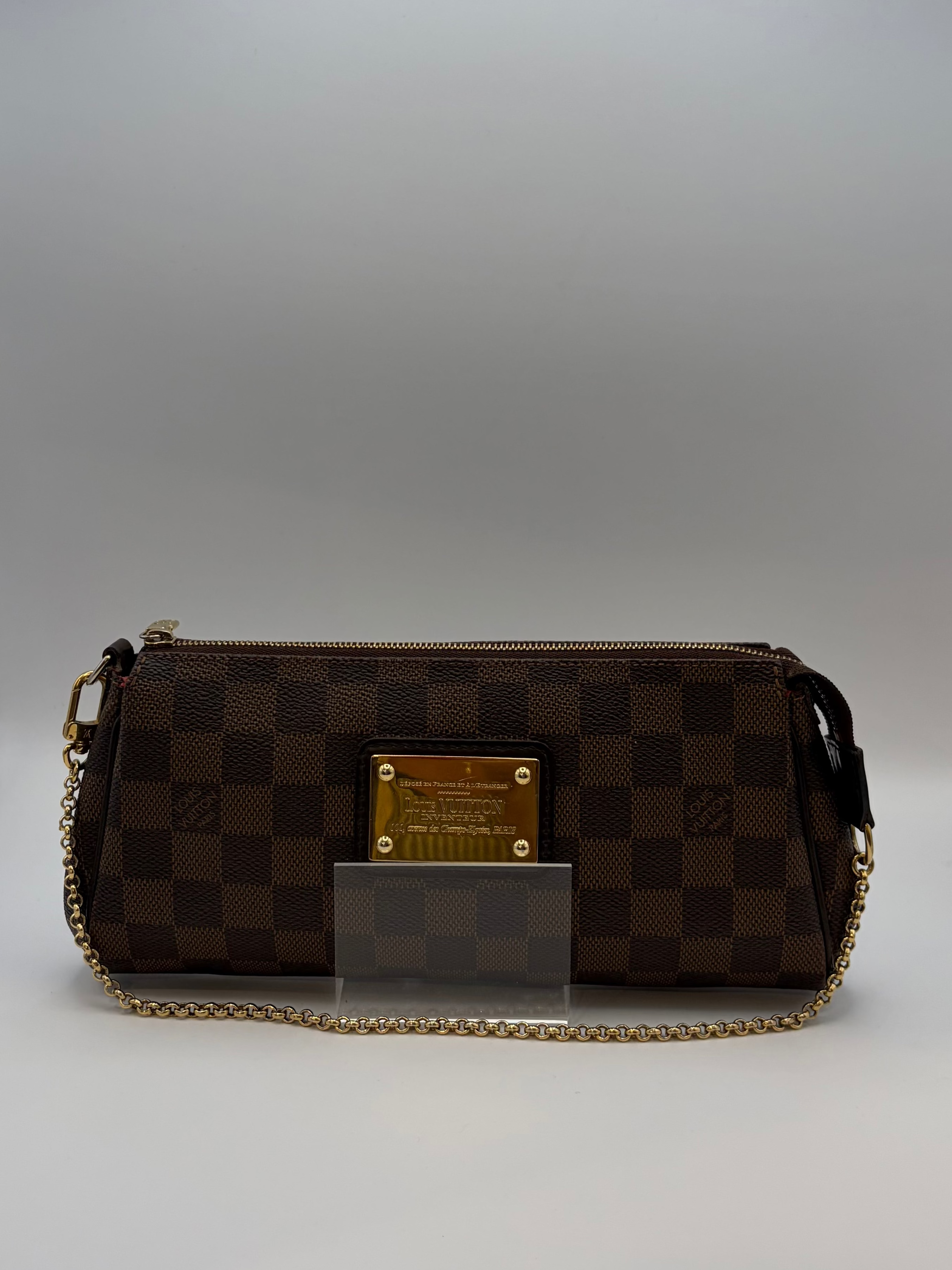 Louis Vuitton Eva Damiere pochette w/ gold-tone logo plate